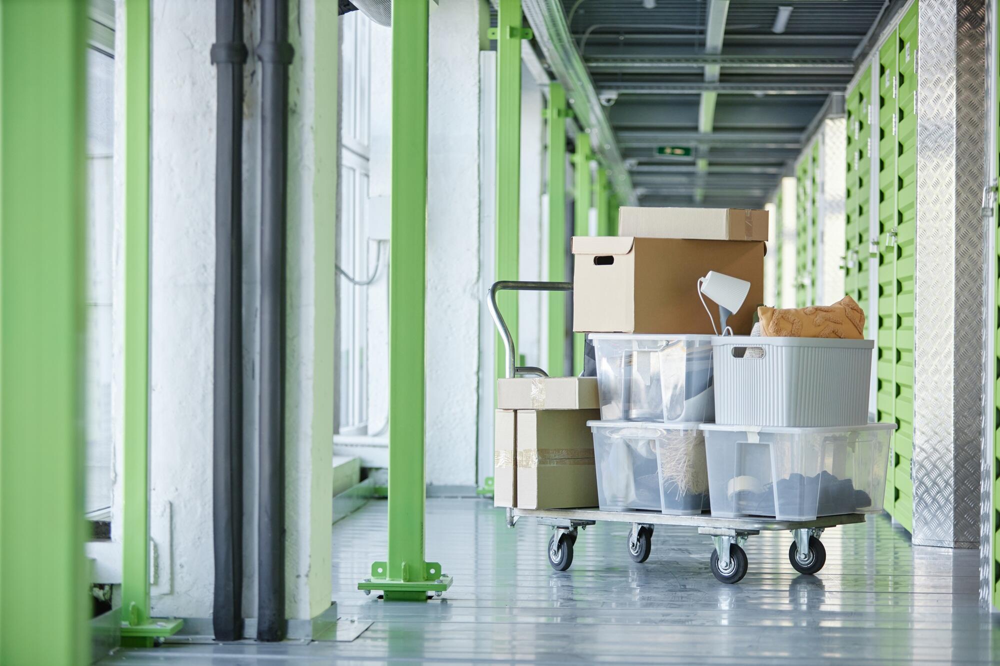 Transportation Trolley Loaded with Personal Possessions in Boxes in Self Storage Warehouse